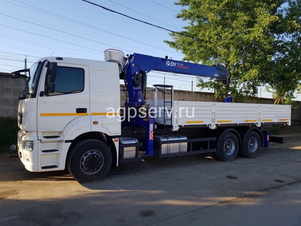 Автомобиль бортовой 438220 на шасси Камаз 65207-1002-87 с КМУ Dong Yang 1956